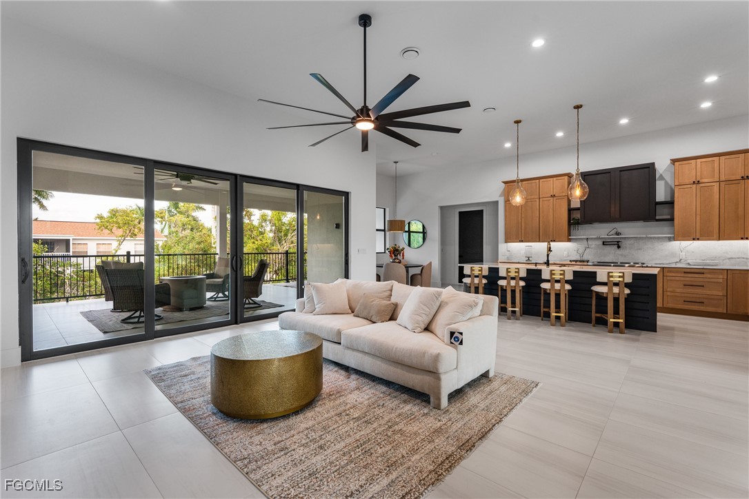 18190 Pioneer Road Fort Myers, FL 33908 - Photo 15 of 45 a living room with furniture and a large window with kitchen view