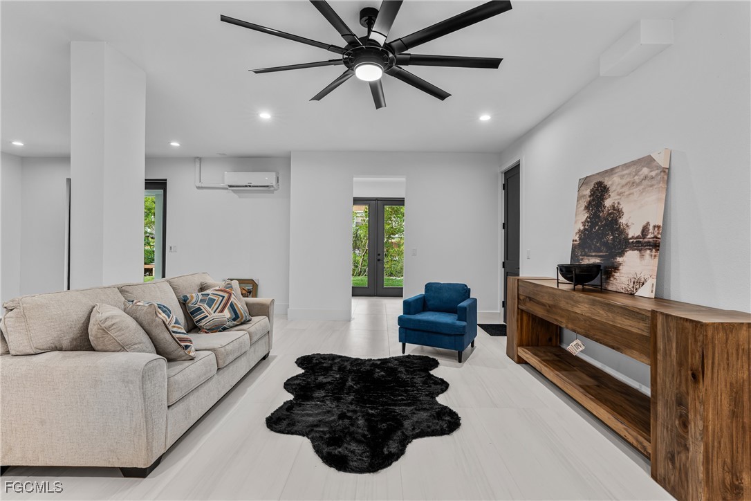 18190 Pioneer Road Fort Myers, FL 33908 - Photo 34 of 45 a living room with furniture ceiling fan and a window
