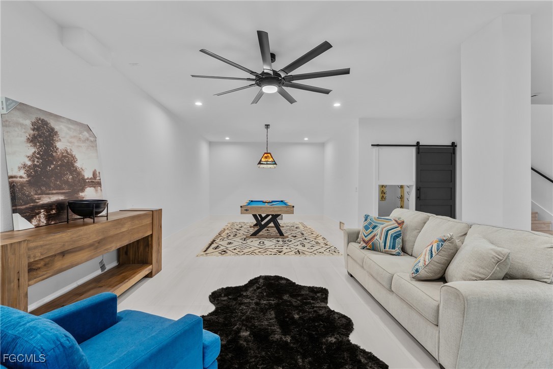 18190 Pioneer Road Fort Myers, FL 33908 - Photo 35 of 45 a living room with furniture and a fireplace