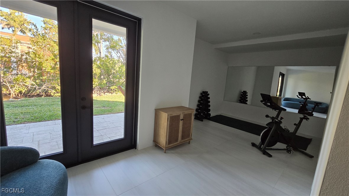 18190 Pioneer Road Fort Myers, FL 33908 - Photo 39 of 45 a view of a room with gym equipment and a large window