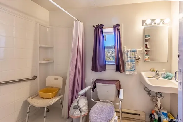 a bathroom with a toilet sink and tub