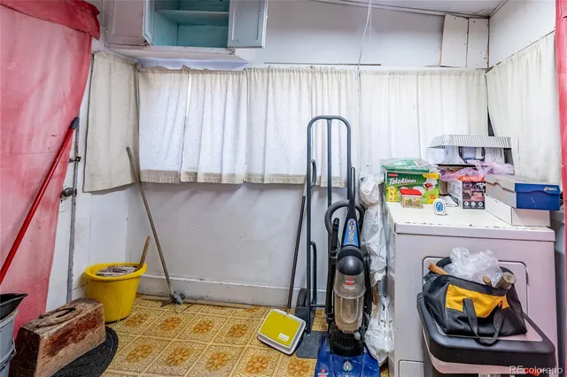 a bathroom with a sink toilet and a mirror