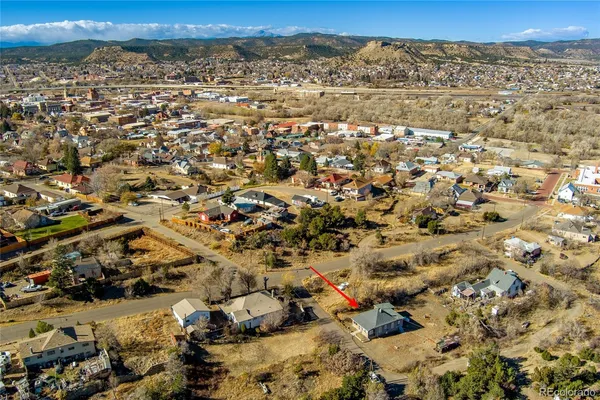 a aerial view of a house with a yard
