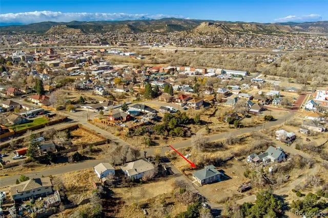 a aerial view of a house with a yard