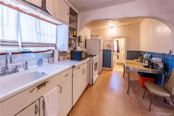 a large kitchen with stainless steel appliances lots of counter space and breakfast area