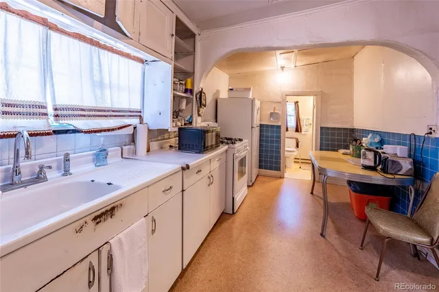 a large kitchen with stainless steel appliances lots of counter space and breakfast area