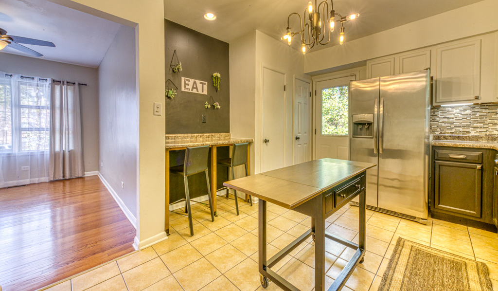 307 North Lake Street Gary, IN 46403 - Photo 16 of 38 a view of a kitchen with dining table and chandelier