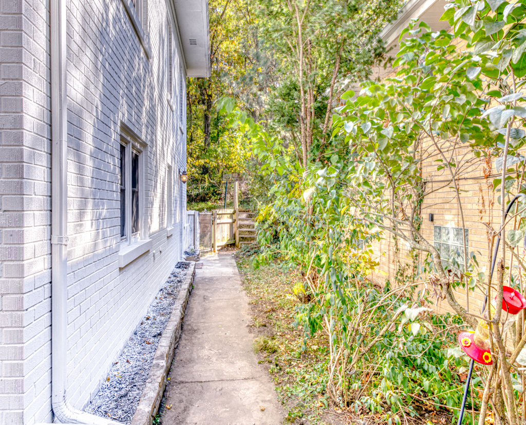 307 North Lake Street Gary, IN 46403 - Photo 22 of 38 a view of a pathway that has lots of flower plants