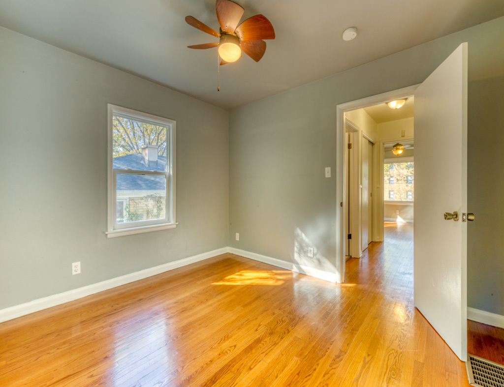 307 North Lake Street Gary, IN 46403 - Photo 24 of 38 a view of a livingroom with wooden floor and a ceiling fan