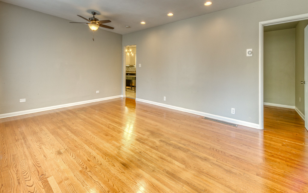 307 North Lake Street Gary, IN 46403 - Photo 33 of 38 wooden floor in an empty room with a window