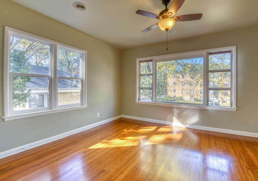 307 North Lake Street Gary, IN 46403 - Photo 5 of 38 a view of an empty room with wooden floor and a window