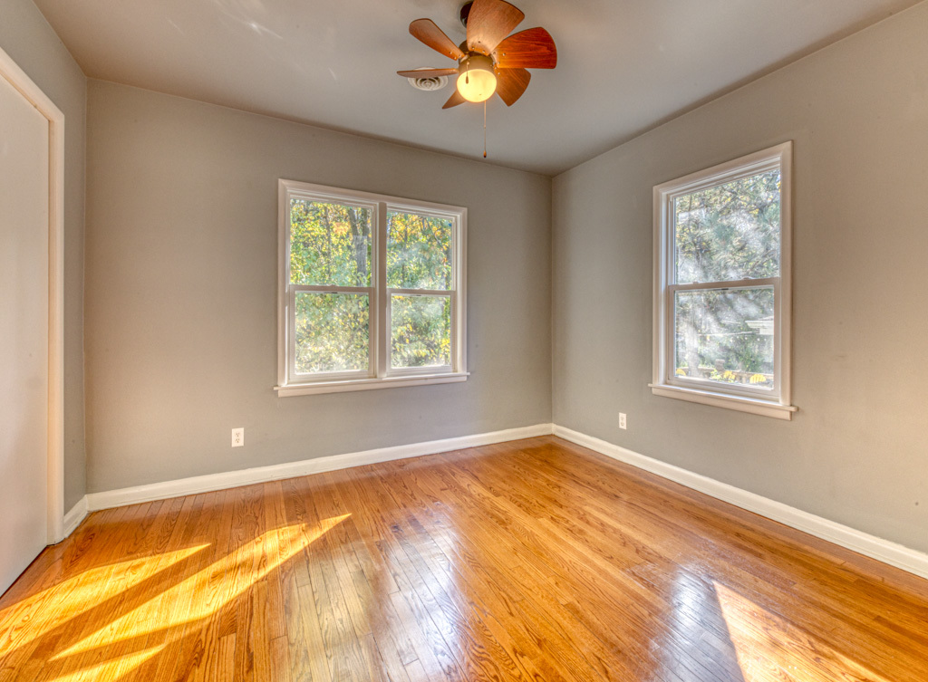 307 North Lake Street Gary, IN 46403 - Photo 8 of 38 a view of an empty room with a window and a ceiling fan