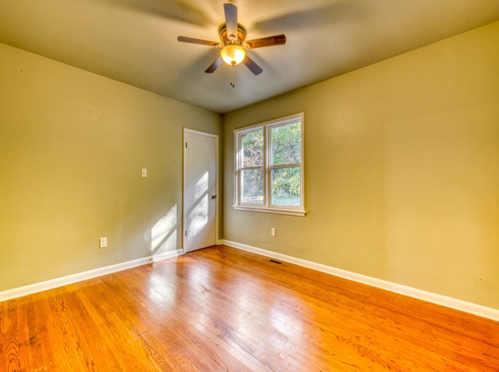 307 North Lake Street Gary, IN 46403 - Photo 10 of 38 a view of a big room with windows and chandelier fan