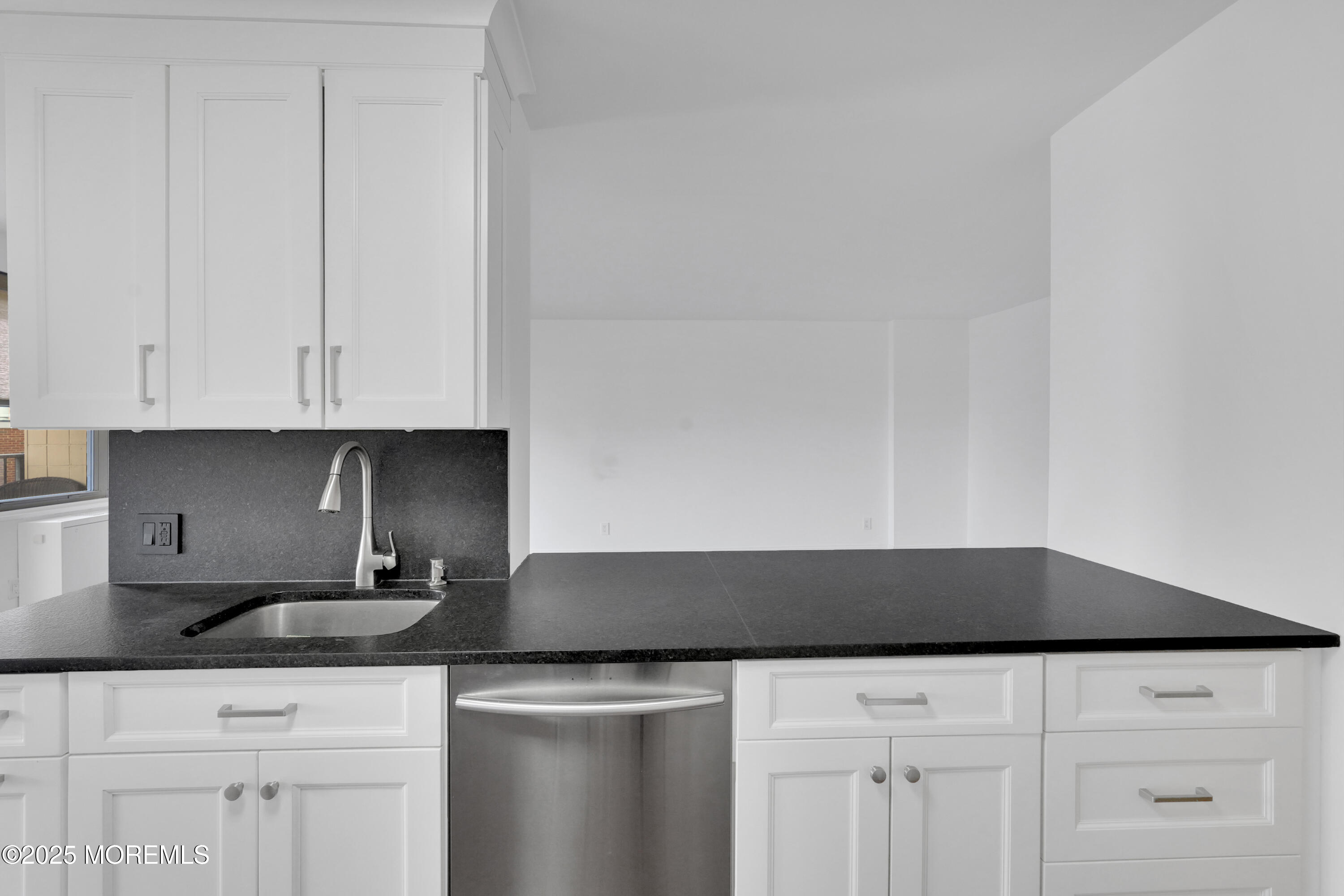 28 Riverside Avenue, Unit 5J Red Bank, NJ 07701 - Photo 3 of 35 a kitchen with white cabinets and a sink