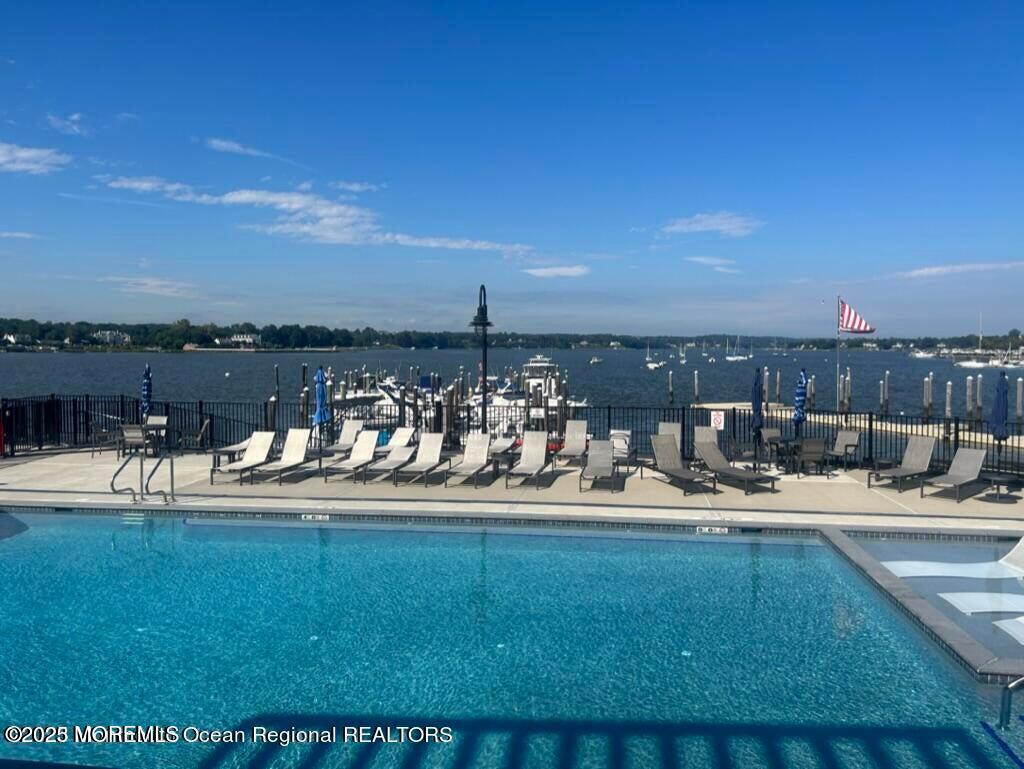 28 Riverside Avenue, Unit 5J Red Bank, NJ 07701 - Photo 32 of 35 a view of a swimming pool with an ocean view