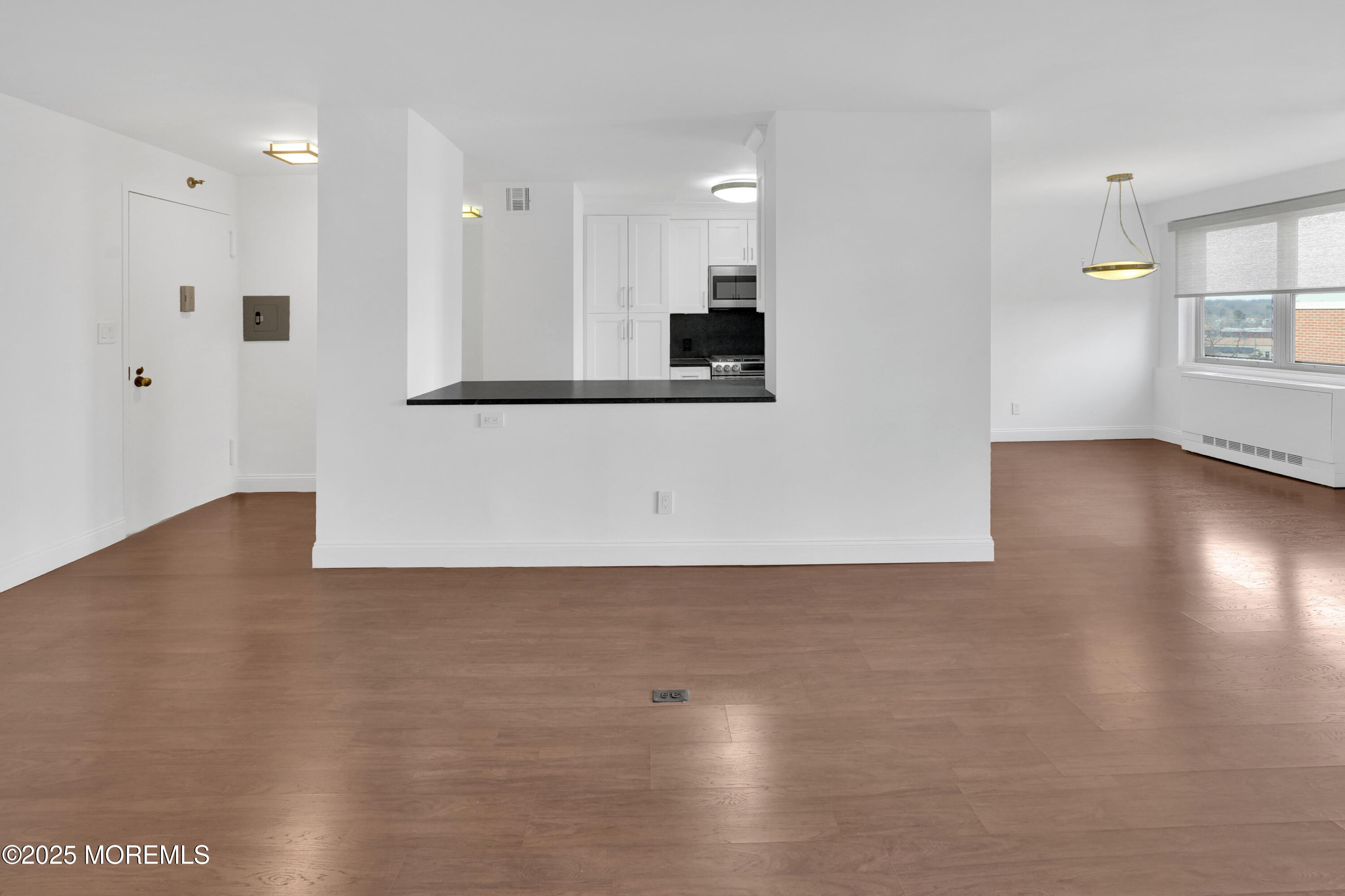 28 Riverside Avenue, Unit 5J Red Bank, NJ 07701 - Photo 10 of 35 a view of a kitchen with a sink and a refrigerator