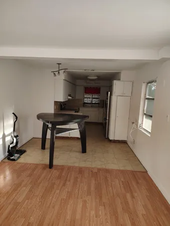a view of a livingroom with furniture and a piano