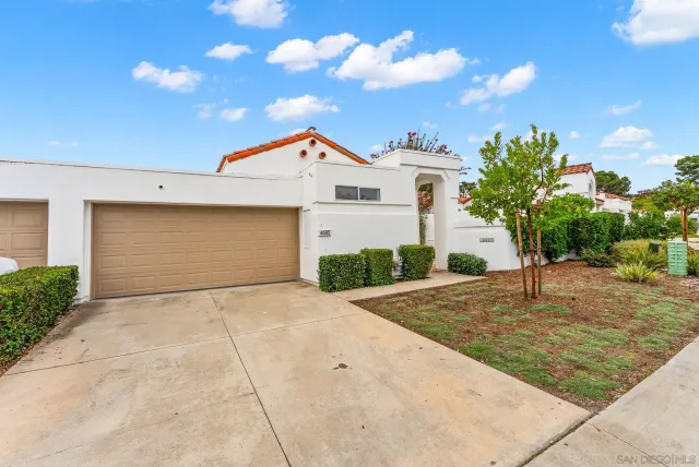 a front view of a house with garage