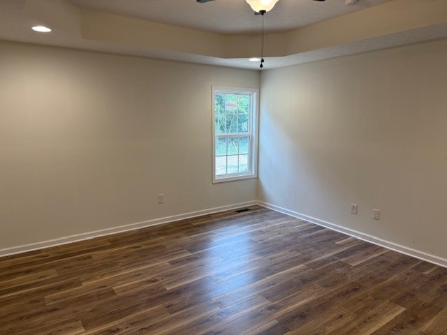 22 Ghea Road Normandy, TN 37360 - Photo 16 of 40 an empty room with wooden floor and windows
