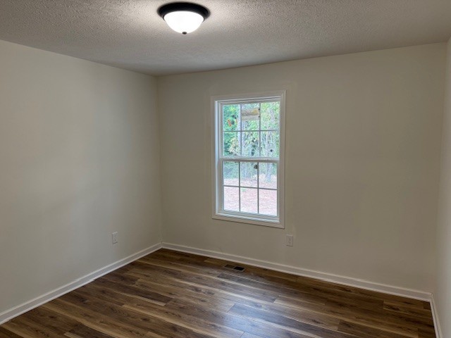 22 Ghea Road Normandy, TN 37360 - Photo 20 of 40 an empty room with wooden floor and windows