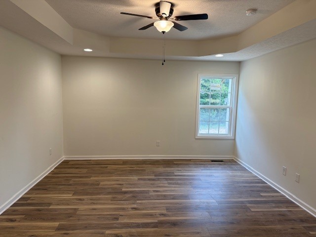 22 Ghea Road Normandy, TN 37360 - Photo 10 of 40 an empty room with wooden floor chandelier fan and windows