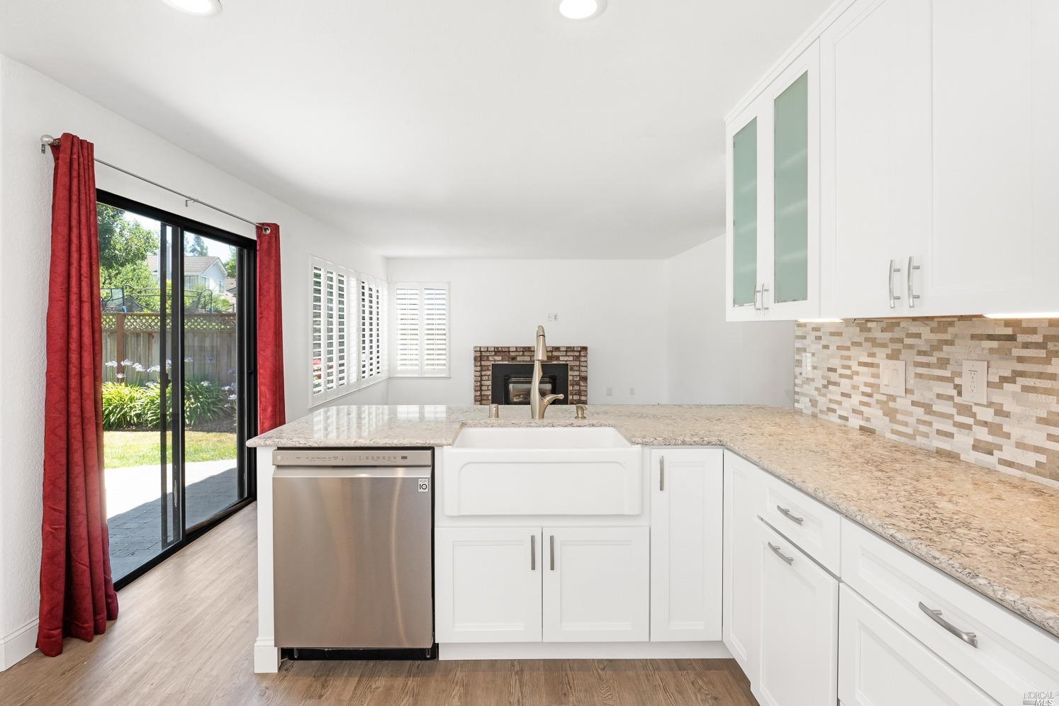 7216 Roxanne Lane Rohnert Park, CA 94928 - Photo 13 of 40 a kitchen with a stove a sink and a microwave