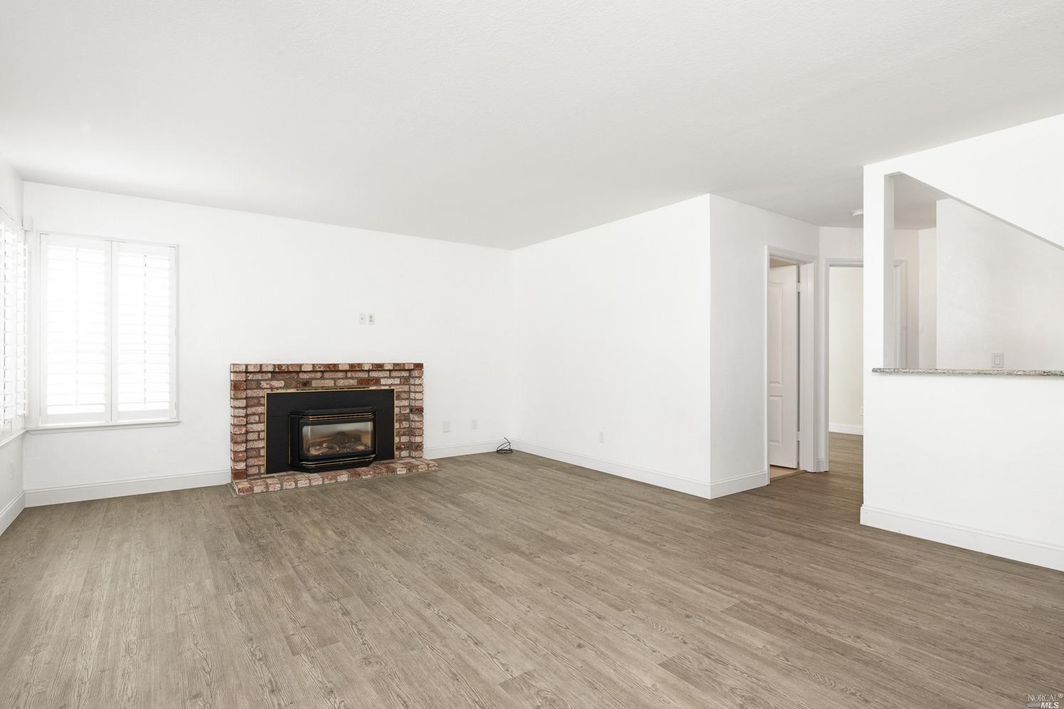 7216 Roxanne Lane Rohnert Park, CA 94928 - Photo 15 of 40 an empty room with a fireplace