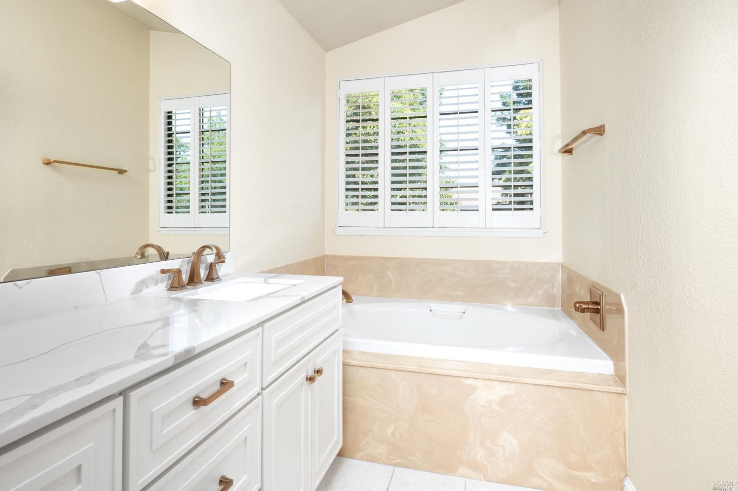 7216 Roxanne Lane Rohnert Park, CA 94928 - Photo 26 of 40 a bathroom with a tub sink and mirror