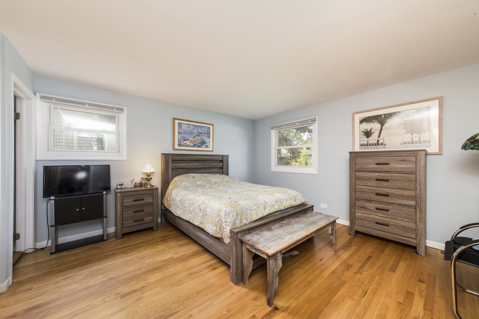 1901 Manor Lane Park Ridge, IL 60068 - Photo 11 of 18 a bedroom with a bed and a flat tv screen on dresser