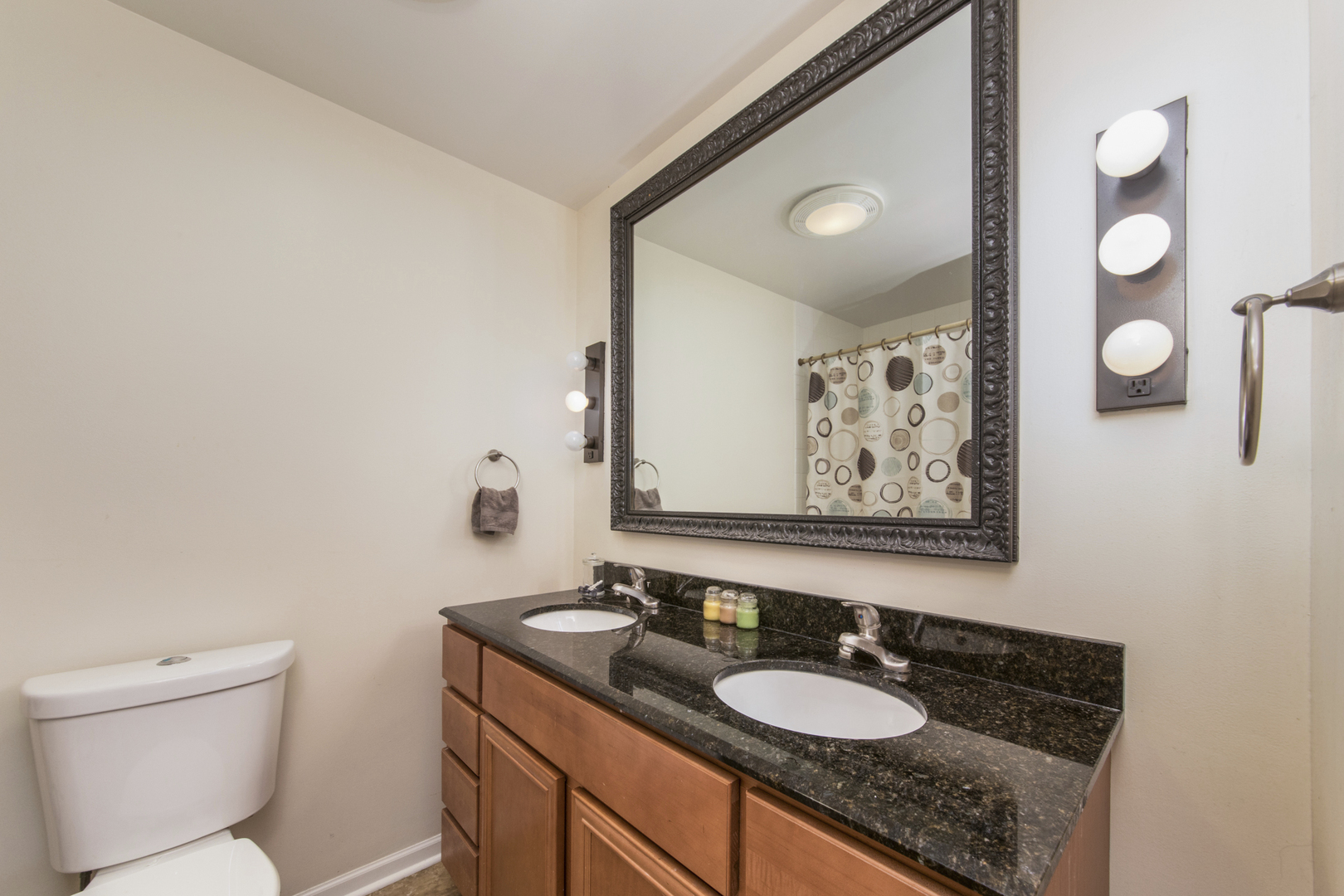 1901 Manor Lane Park Ridge, IL 60068 - Photo 15 of 18 a bathroom with a granite countertop sink toilet and mirror