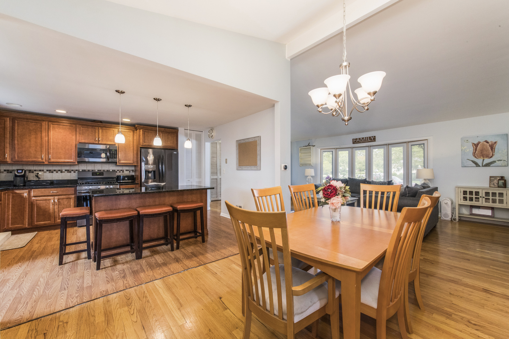 1901 Manor Lane Park Ridge, IL 60068 - Photo 5 of 18 a view of a dining room with furniture a chandelier and wooden floor