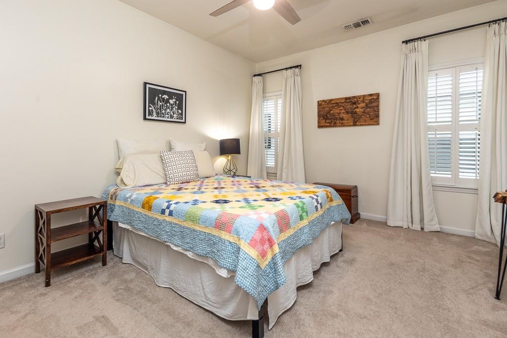 1290 Isle Pointe Drive Memphis, TN 38103 - Photo 15 of 30 a bedroom with a bed and a night stand