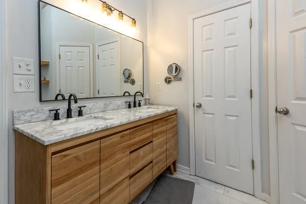 a bathroom with a sink and a mirror