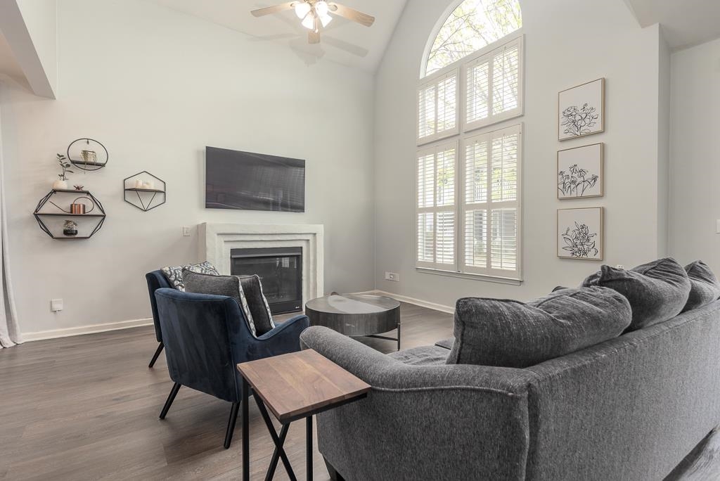1290 Isle Pointe Drive Memphis, TN 38103 - Photo 6 of 30 a living room with furniture a fireplace and a window