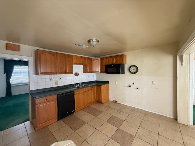 3714 Christie Street Houston, TX 77026 - Photo 23 of 24 a kitchen with stainless steel appliances a sink and a stove