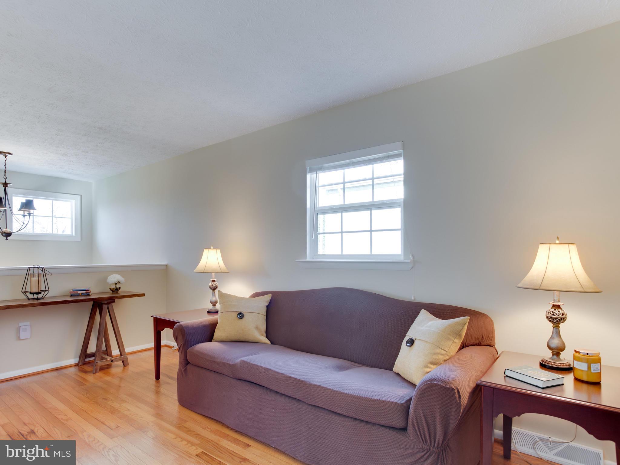 1925 Grant Road Baltimore, MD 21227 - Photo 11 of 44 a living room with furniture and a lamp