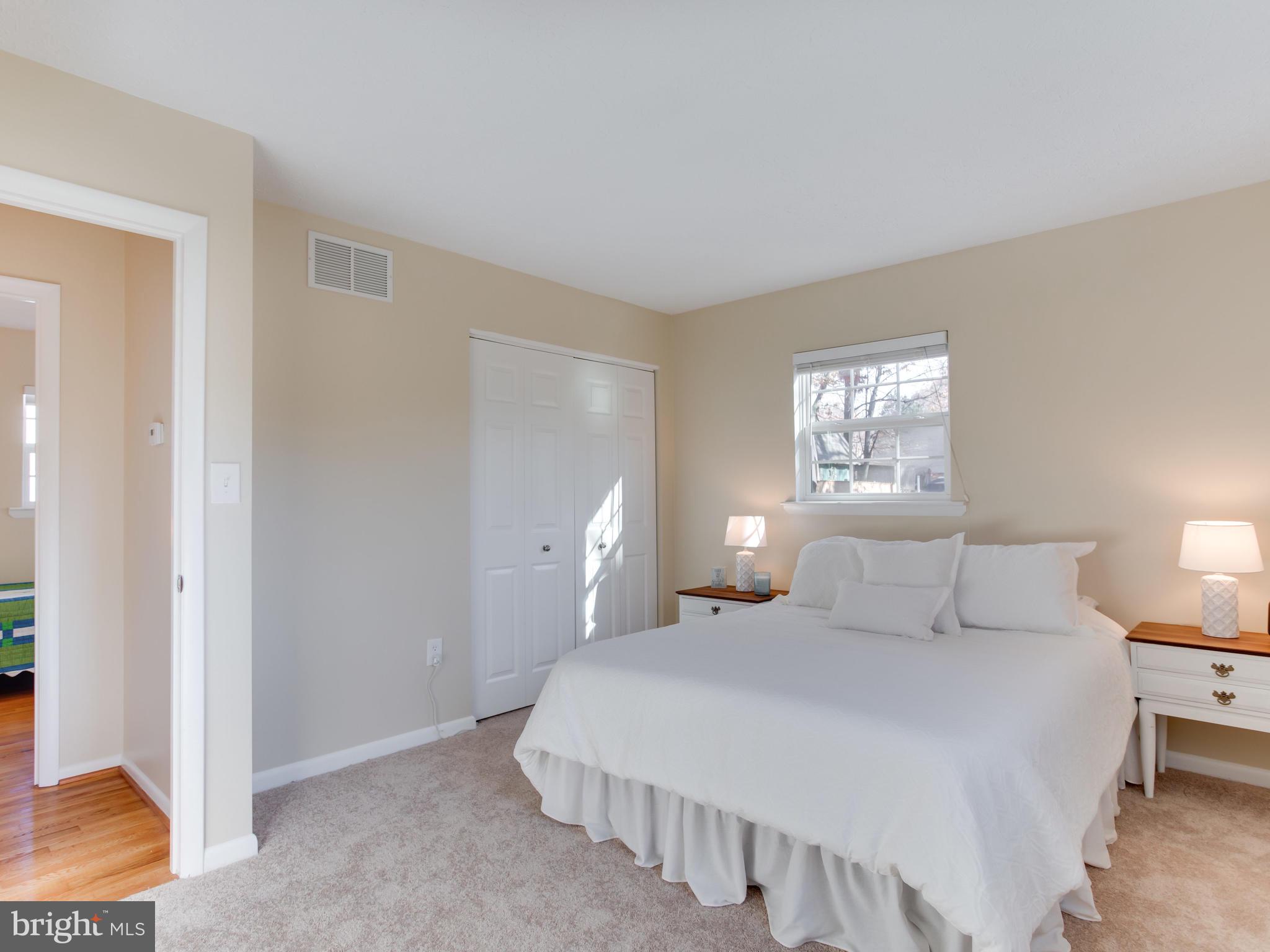 1925 Grant Road Baltimore, MD 21227 - Photo 20 of 44 a bedroom with a bed and a lamp with window