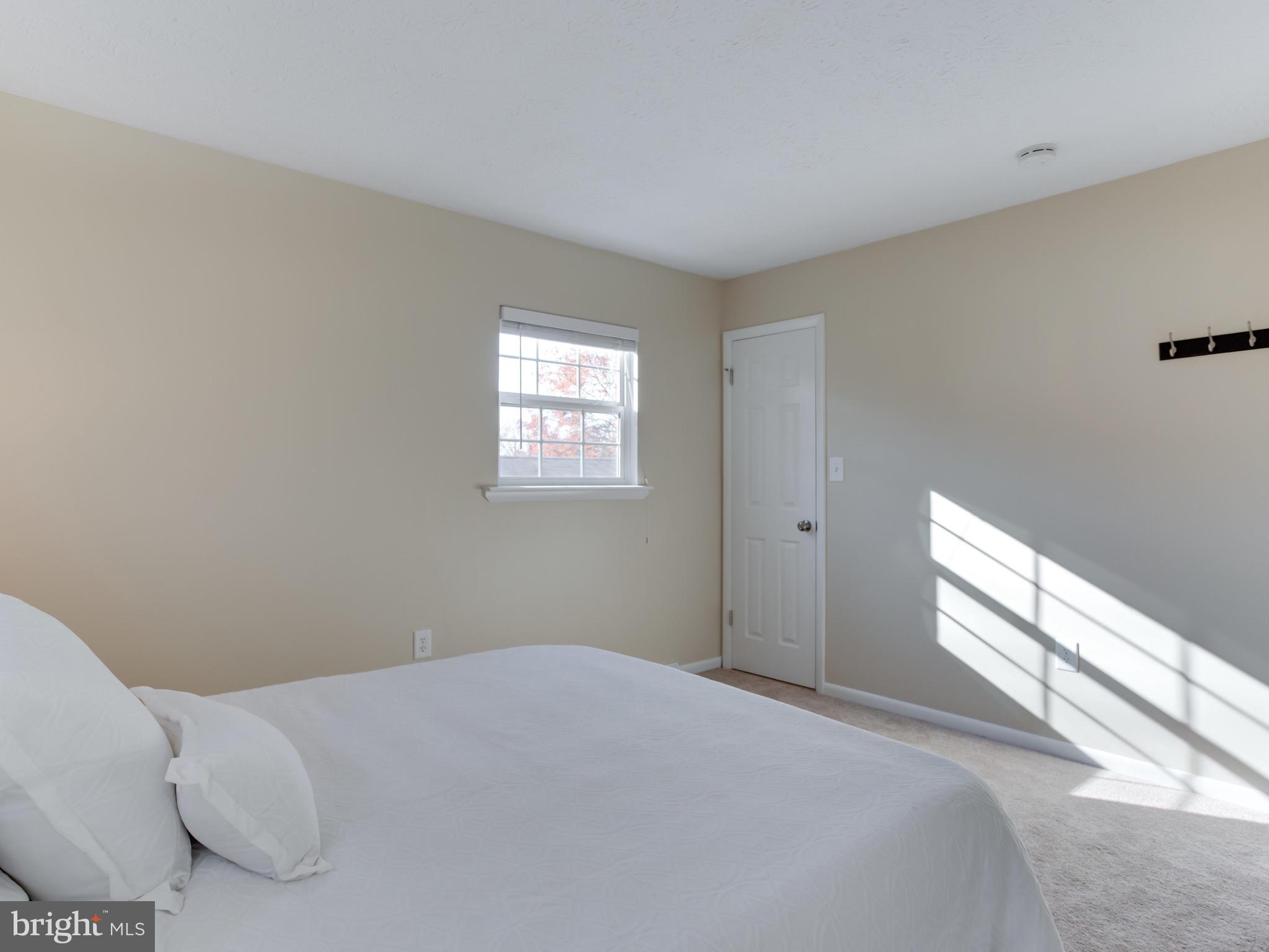 1925 Grant Road Baltimore, MD 21227 - Photo 22 of 44 a bedroom with a bed and a window
