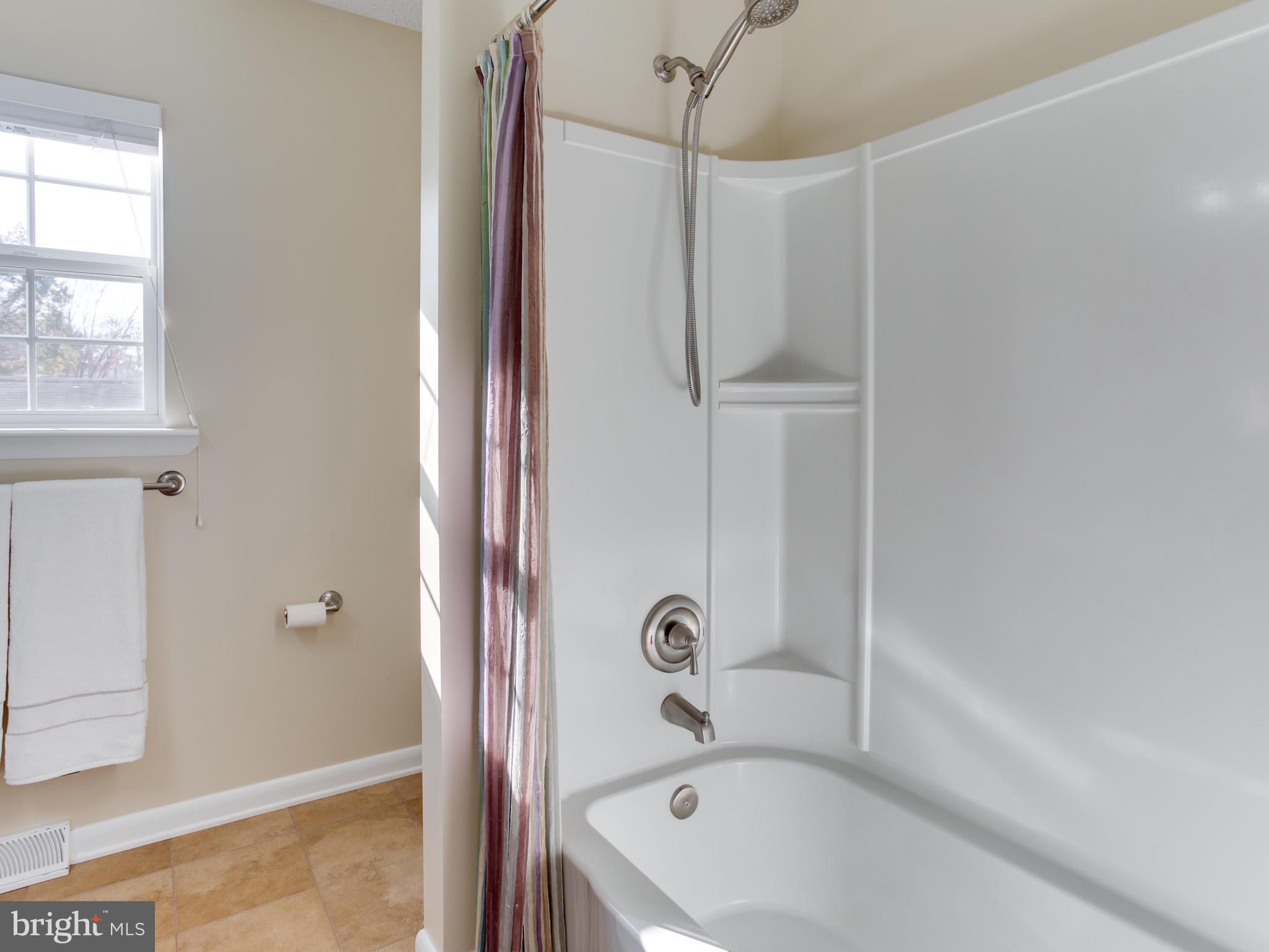 1925 Grant Road Baltimore, MD 21227 - Photo 25 of 44 a bathroom with a tub and shower