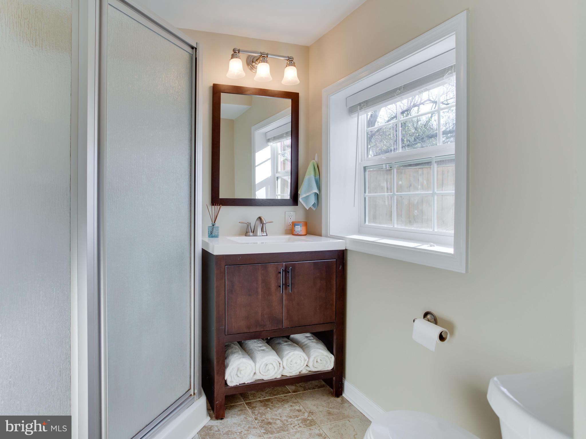 1925 Grant Road Baltimore, MD 21227 - Photo 29 of 44 a bathroom with a sink and a mirror