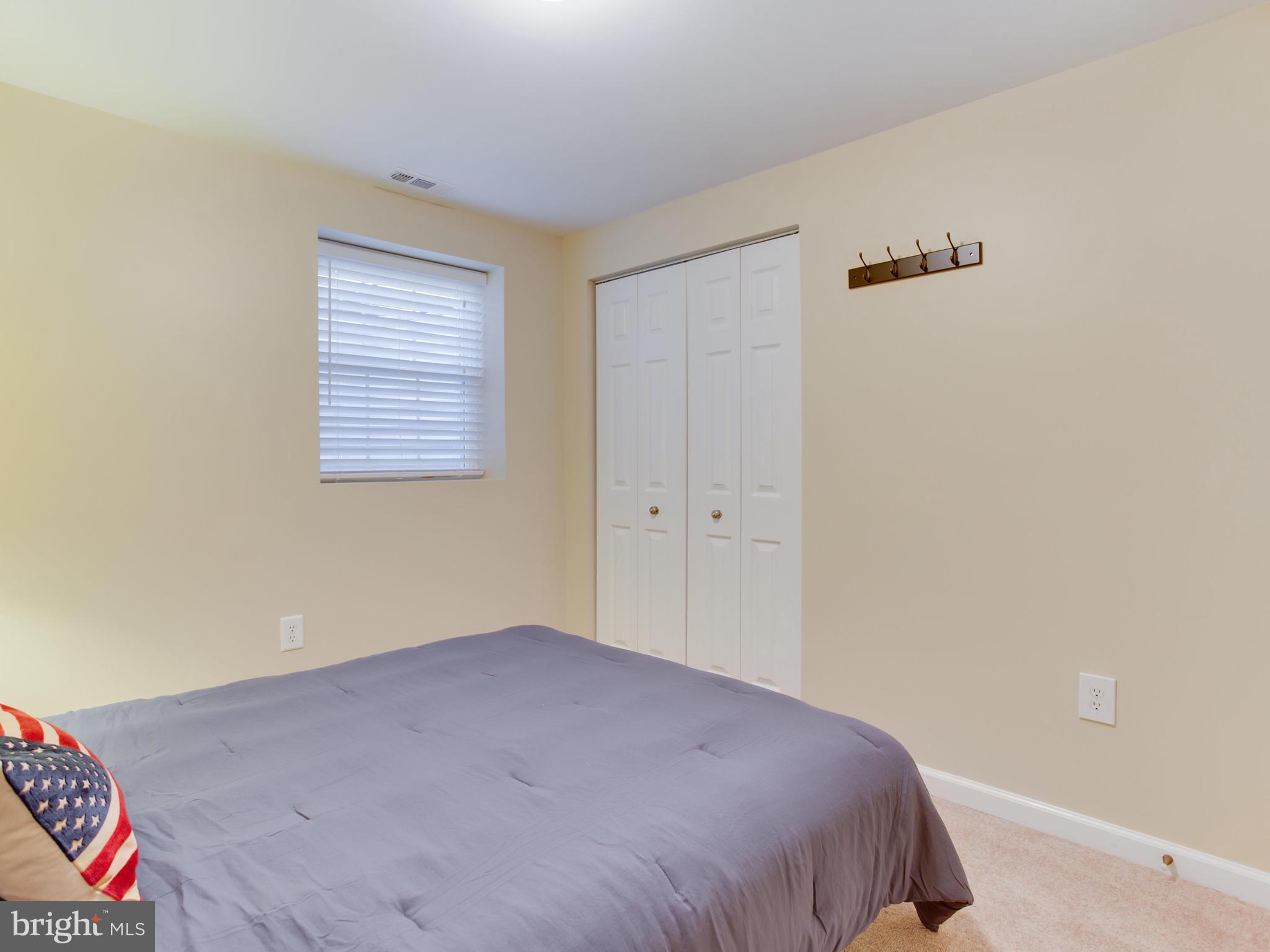 1925 Grant Road Baltimore, MD 21227 - Photo 32 of 44 a bedroom with a bed and a window