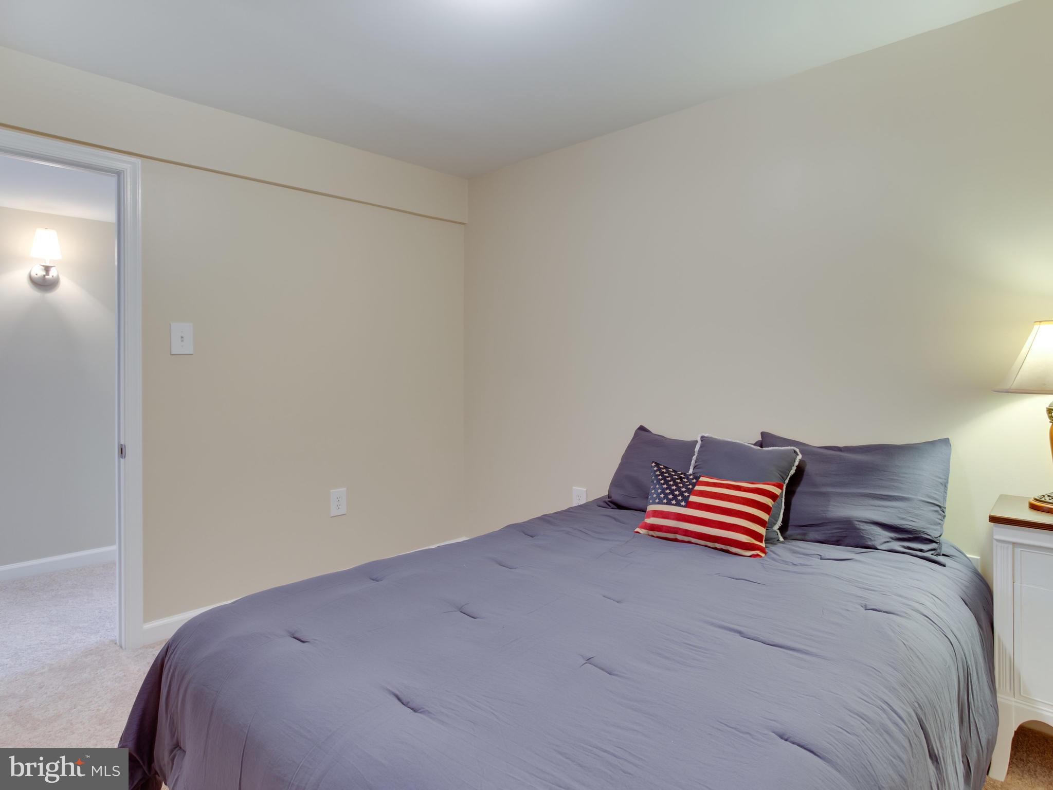 1925 Grant Road Baltimore, MD 21227 - Photo 33 of 44 a bedroom with a bed and wooden floor