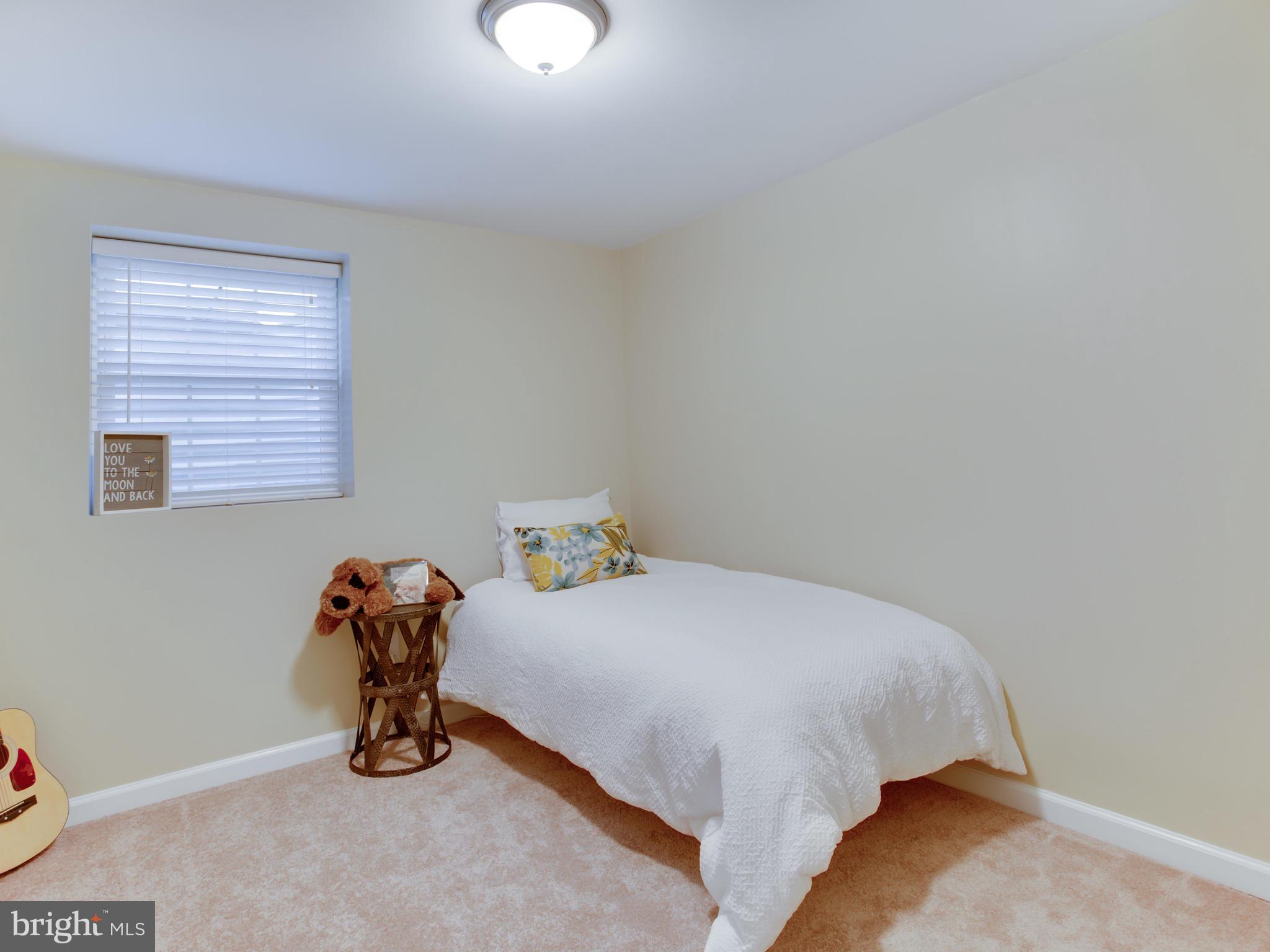 1925 Grant Road Baltimore, MD 21227 - Photo 35 of 44 a bedroom with a bed and wooden floor