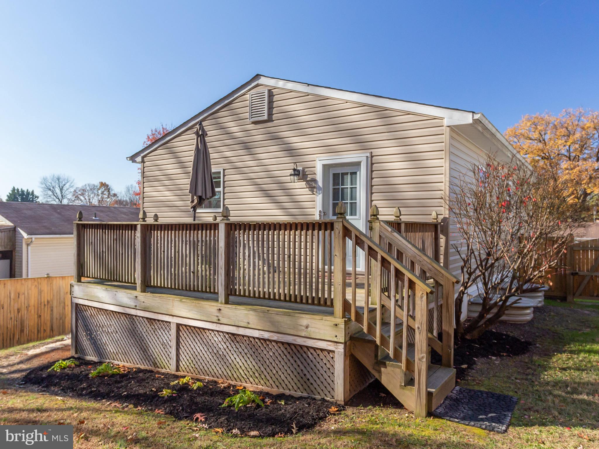 1925 Grant Road Baltimore, MD 21227 - Photo 41 of 44 a view of a house with a wooden deck