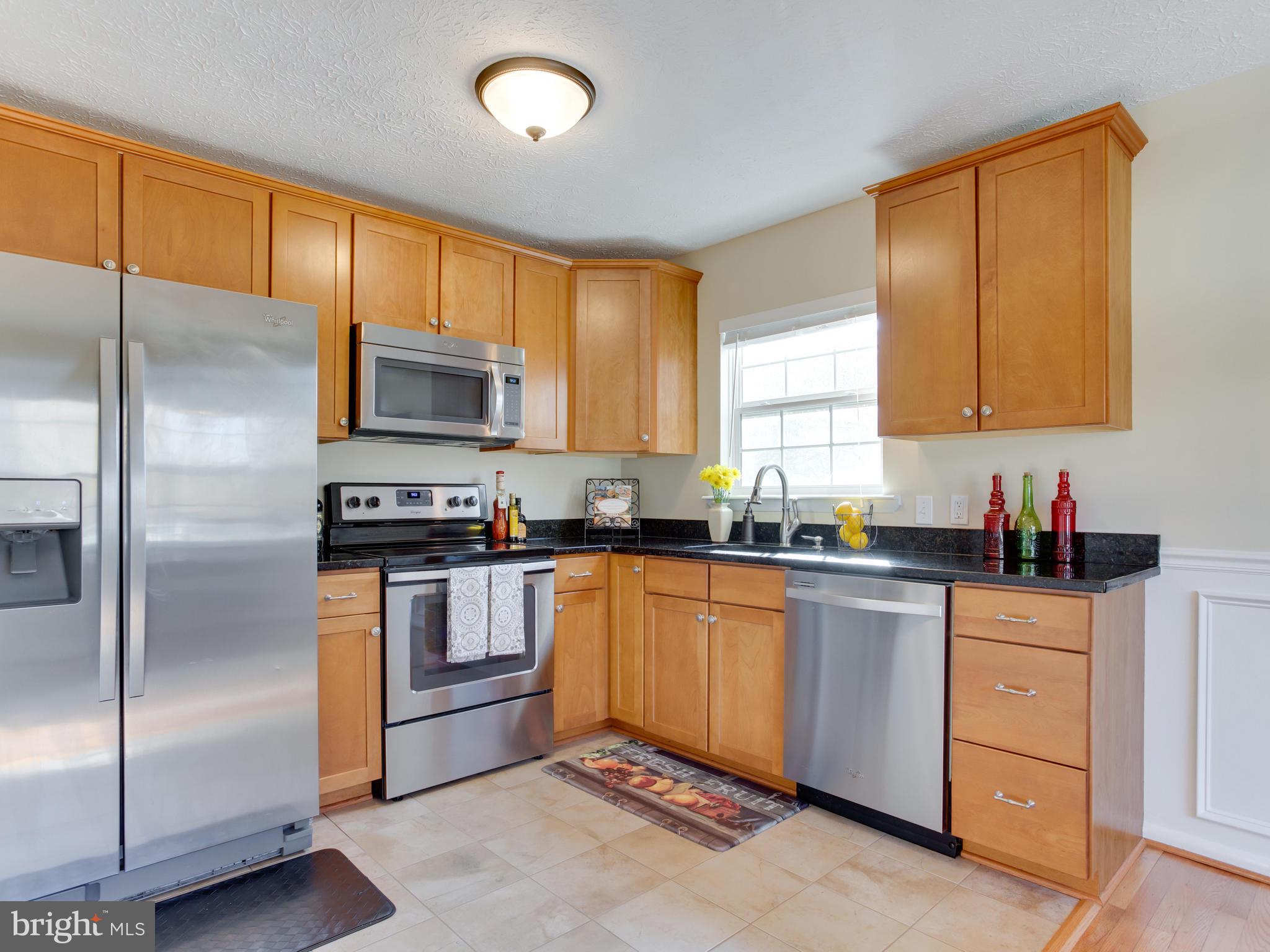 1925 Grant Road Baltimore, MD 21227 - Photo 6 of 44 a kitchen with a sink stainless steel appliances and cabinets