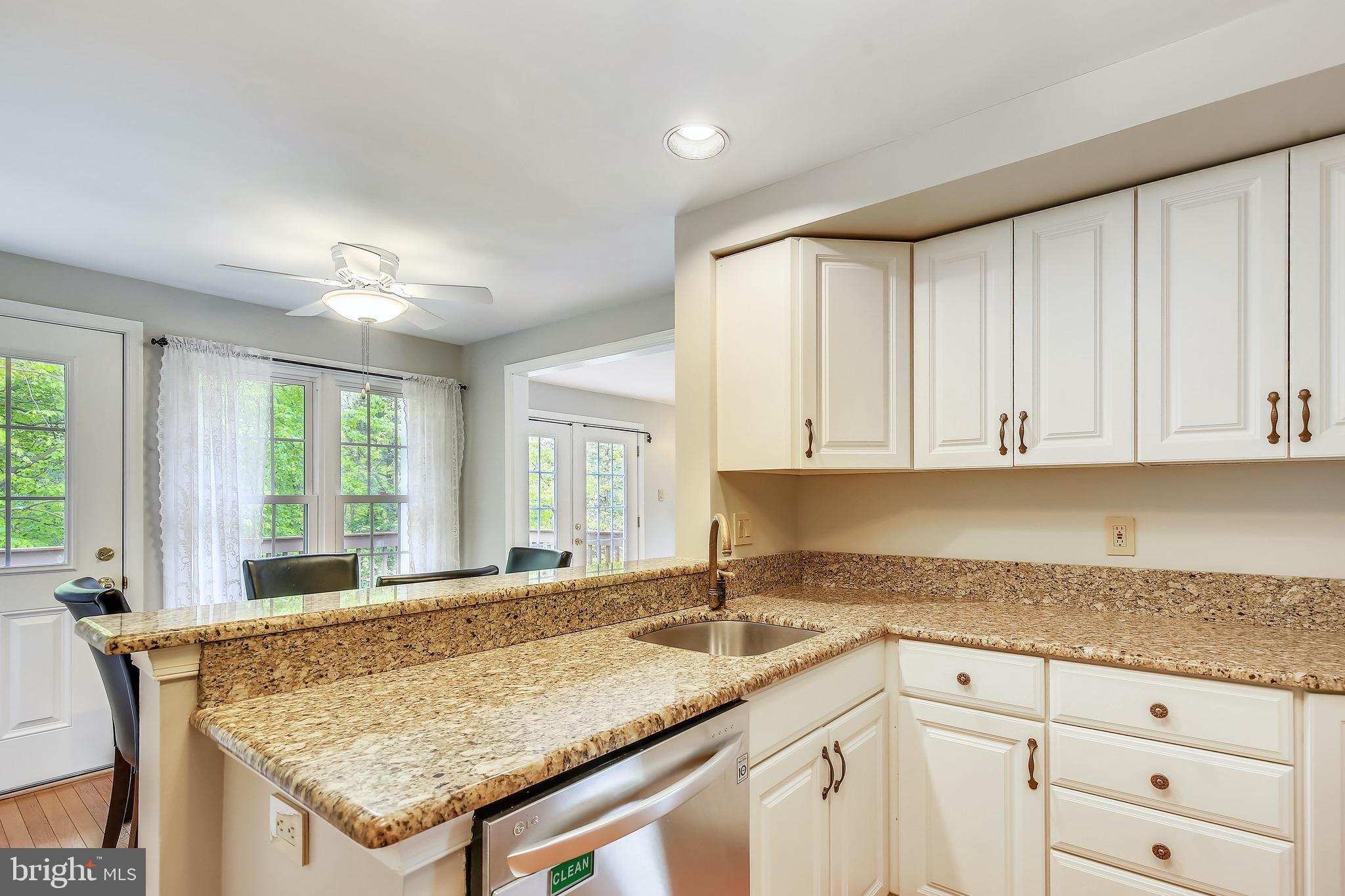 1530 Deer Point Way Reston, VA 20194 - Photo 10 of 42 a kitchen with granite countertop sink and cabinets