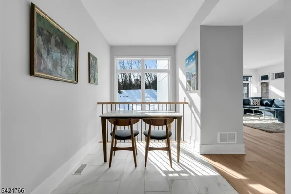 a dining room with furniture and window