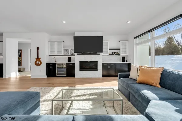 a living room with fireplace furniture and a flat screen tv