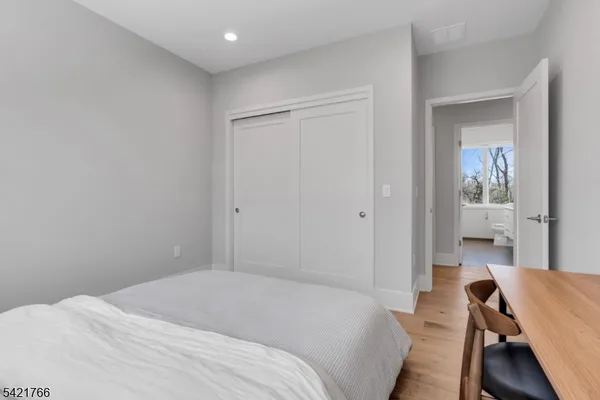 a bedroom with a bed and a table in it