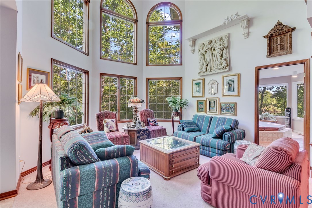 1167 Ottoman Ferry Road Lancaster, VA 22503 - Photo 12 of 52 Two-story living area featuring multiple arched an